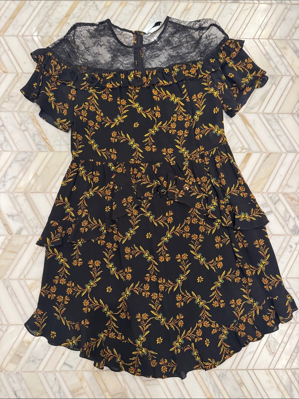 Sandro ParisBlack Mini Dress with Yellow Floral Print and Lace Yoke